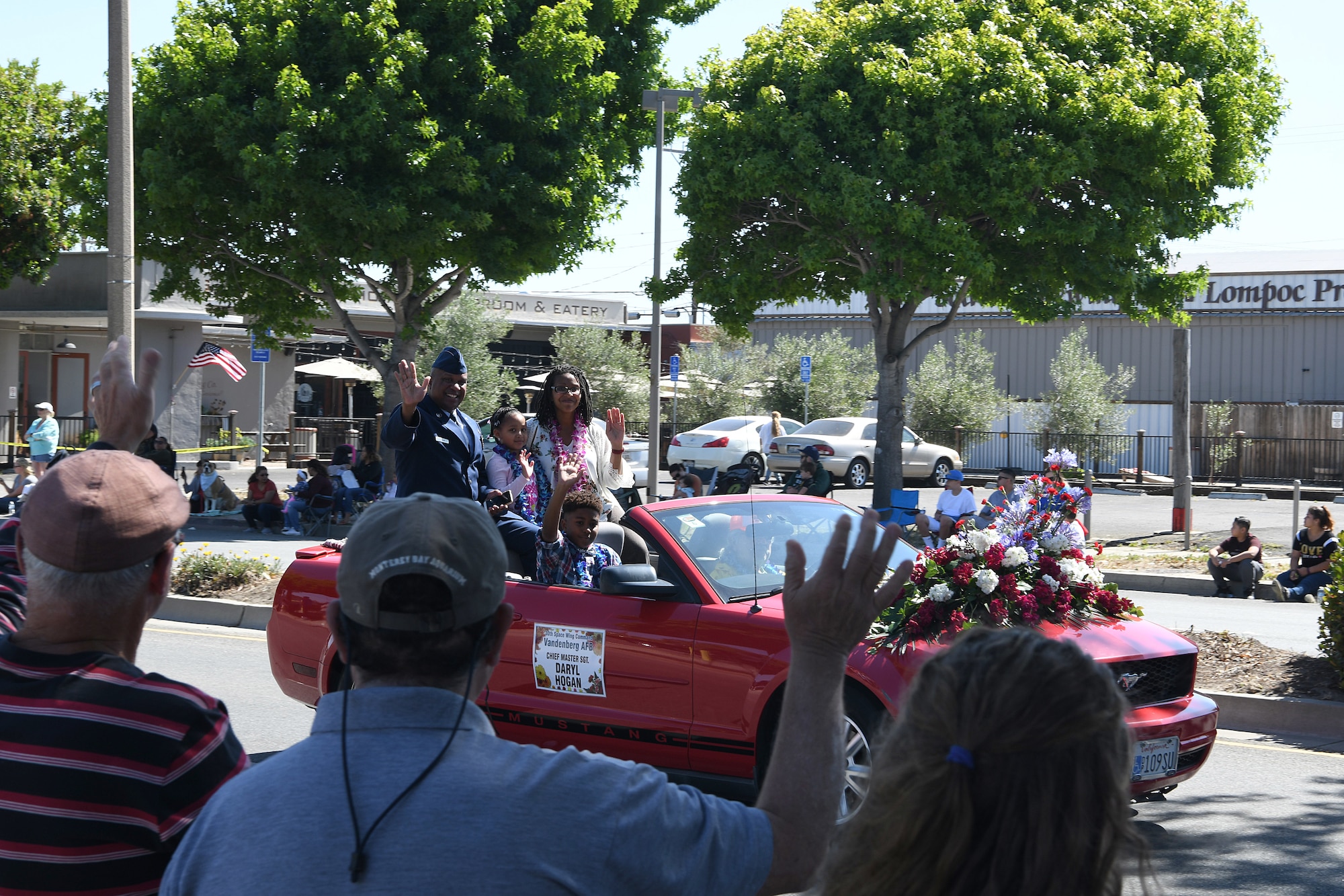 Chief Master Sgt. Daryl Hogan Jr., 30th Space Wing command chief, and his family participate in the 2019 Lompoc Flower Festival Parade June 29, 2019, in Lompoc, Calif.