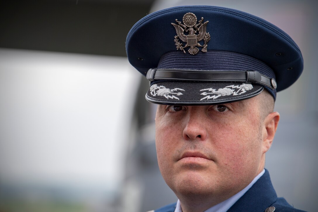 Lt. Col Jason Hock, 21st Special Operations Squadron commander, poses for a photo immediately following the assumption of command ceremony at Yokota Air Base, Japan, July 1, 2019.