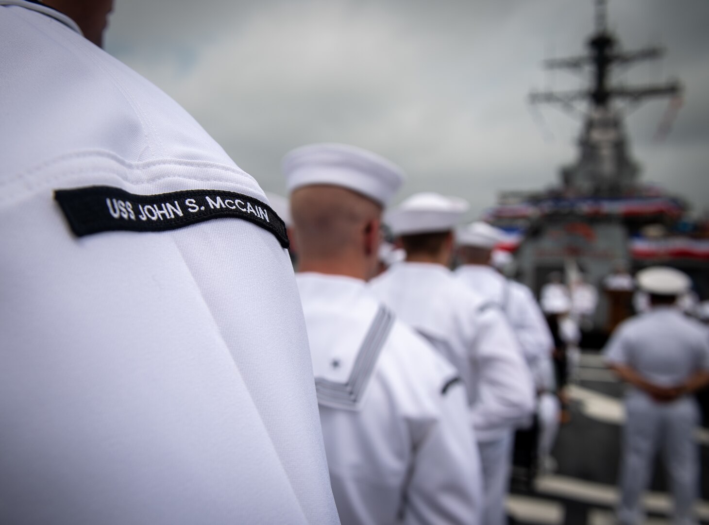 The crew of USS John S. McCain (DDG 56) stand in formation during the ship’s 25th anniversary and change of command ceremony, July 2, 2019 at Commander, Fleet Activities Yokosuka, Japan. McCain was commissioned on July 2, 1994 in Bath, Maine and was originally named in honor of Admirals John S. McCain Sr. and Jr. In a rededication ceremony on July 12, 2018 the late Sen. John S. McCain III was officially added to the namesake.
