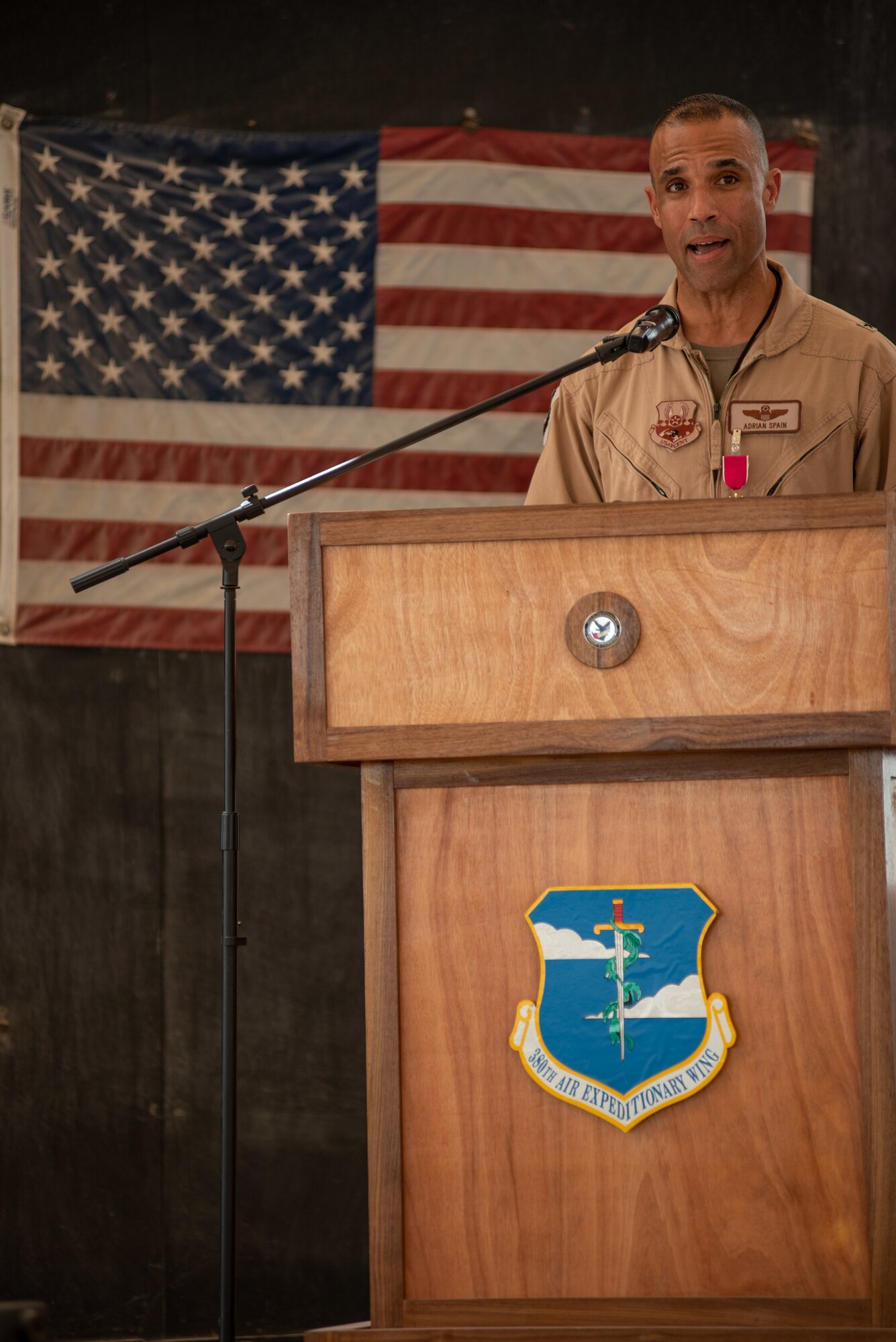Brig. Gen Adrian L. Spain, 380th Air Expeditionary Wing commander, speaks during the wing change of command ceremony July 1, 2019, at Al Dhafra Air Base, United Arab Emirates.