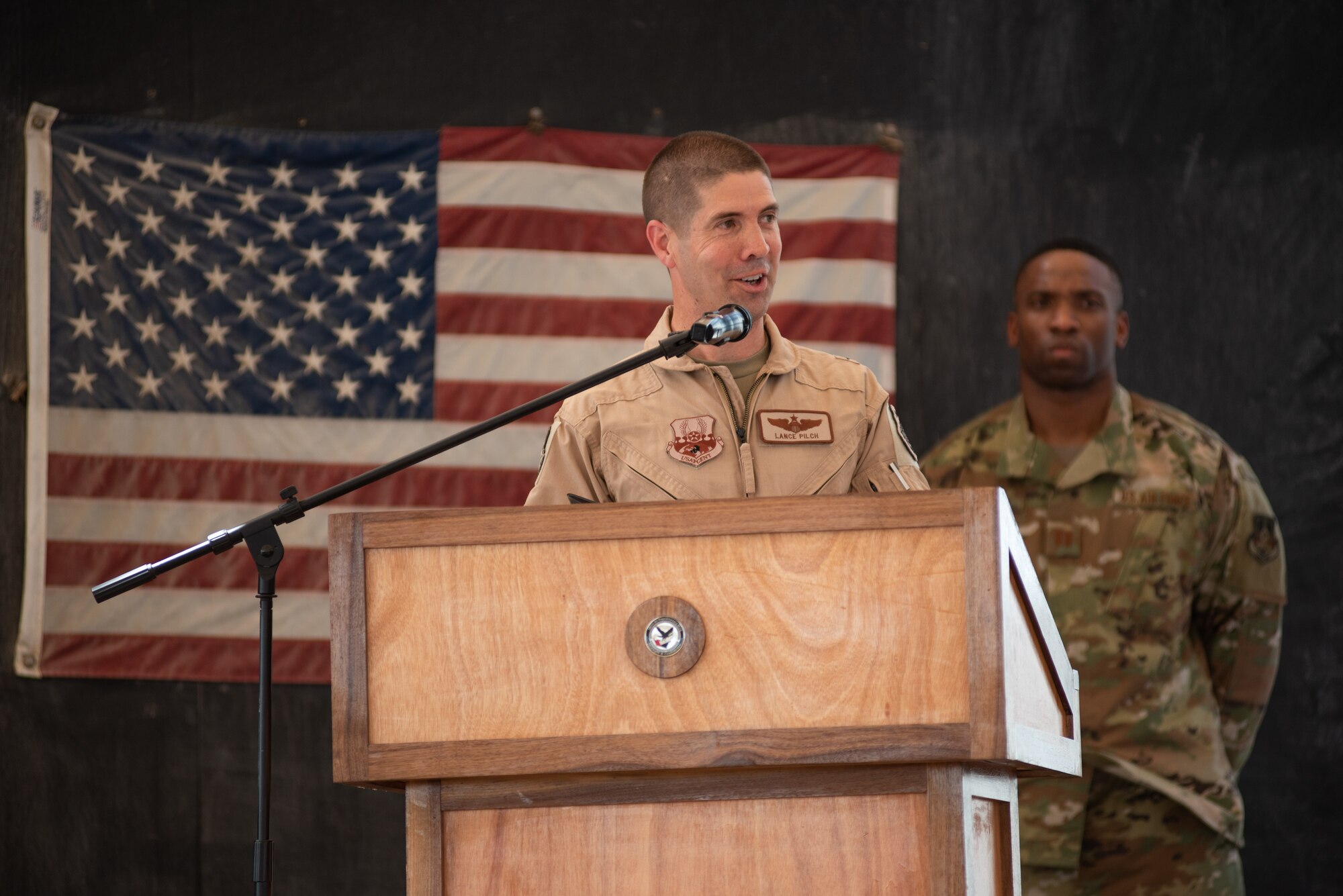 Brig. Gen. Lance Pilch, speaks during the 380th Air Expeditionary Wing Change of Command ceremony July 1, 2019, at Al Dhafra Air Base, United Arab Emirates