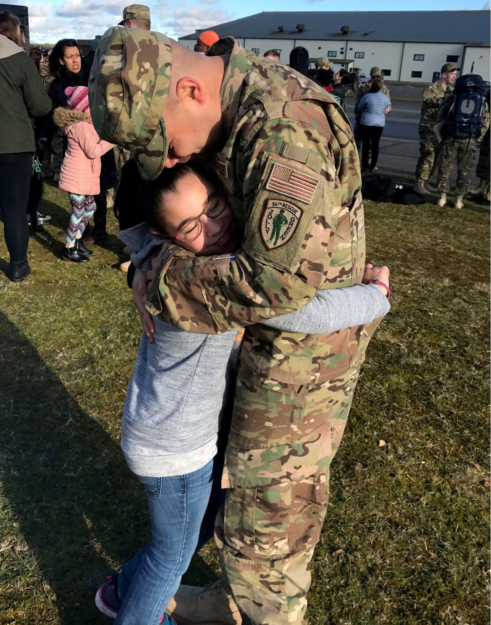 U.S. Air Force Master Sgt. Richard Duken, first sergeant of the 57th Rescue Squadron from Aviano Air Base, Italy, hugs his daughter. (Courtesy Photo)