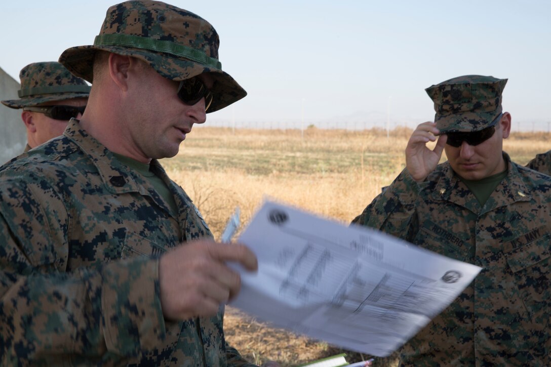A U.S. Marine with the Special Purpose Marine Air-Ground Task Force-Crisis Response-Africa 19.2, Marine Forces Europe and Africa, gives a safety brief during an advanced-manufacturing charge range at Naval Air Station Sigonella, Italy, June 25, 2019