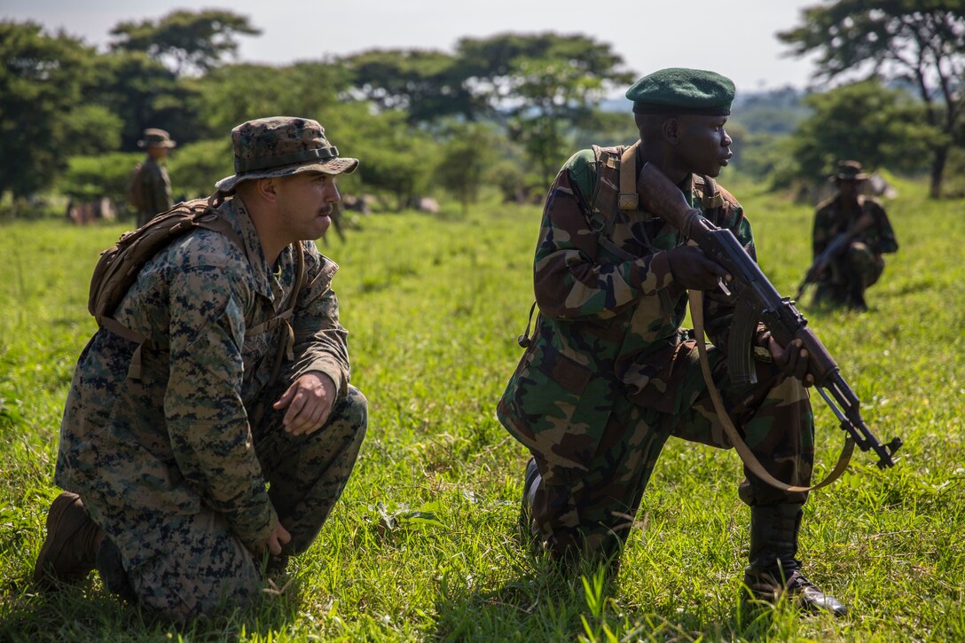 A U.S. Marine with Special Purpose Marine Air-Ground Task Force-Crisis Response-Africa 19.2, Marine Forces Europe and Africa, advises a member of the Uganda People’s Defence Force during a theater security exercise at Peace Support Operations Training Center Camp Singo, Uganda, June 12, 2019.