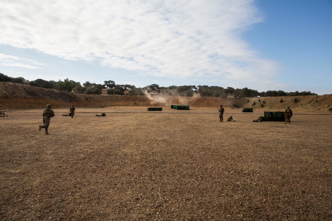 U.S. Marines with Special Purpose Marine Air-Ground Task Force-Crisis Response-Africa 19.2, Marine Forces Europe and Africa, conduct a squad attack on Campo De Maniobras, Base General Menacho, Spain, June 20, 2019. The Marines integrated with Spanish army operations to enhance interoperability with Spanish allies. SPMAGTF-CR-AF is deployed to conduct crisis-response and theater-security operations in Africa and promote regional stability by conducting military-to-military training exercises throughout Europe and Africa. (U.S. Marine Corps photo by Cpl. Margaret Gale)