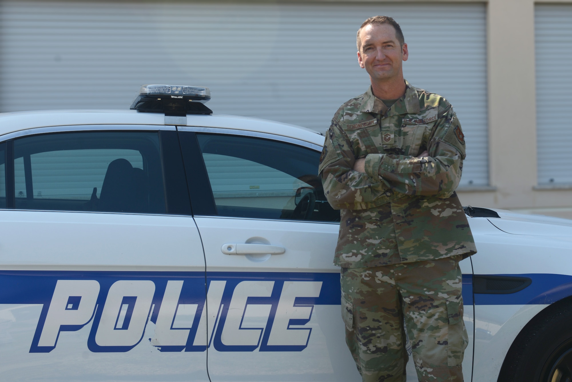U.S. Air Force Senior Master Sgt. Jeremy Schoneboom, first sergeant of the 31st Security Forces Squadron poses for a photo next to a vehicle at Aviano Air Base, Italy, June 26, 2019. The 31st Security Forces Squadron maintains installation force protection during peacetime and wartime operations within eight separate base areas. (U.S. Air Force photo by Airman 1st Class Ericka A. Woolever).