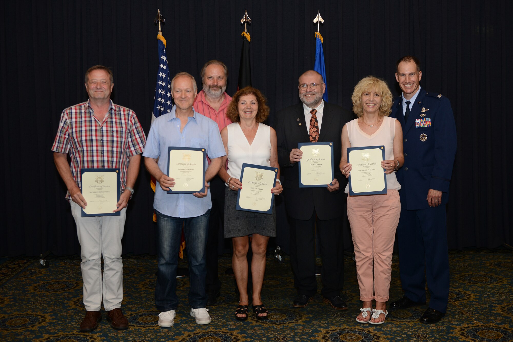 Recipients of the Civilian Length of Service award stand with U.S. Air Force Col. Matthew Husemann, 86th Airlift Wing vice commander, for a group photo during a ceremony on Ramstein Air Base, Germany, June 27, 2019. The recipients served 40 years of continued service to the U.S. Armed Forces. (U.S. Air Force photo by Airman 1st Class Jennifer Gonzales)