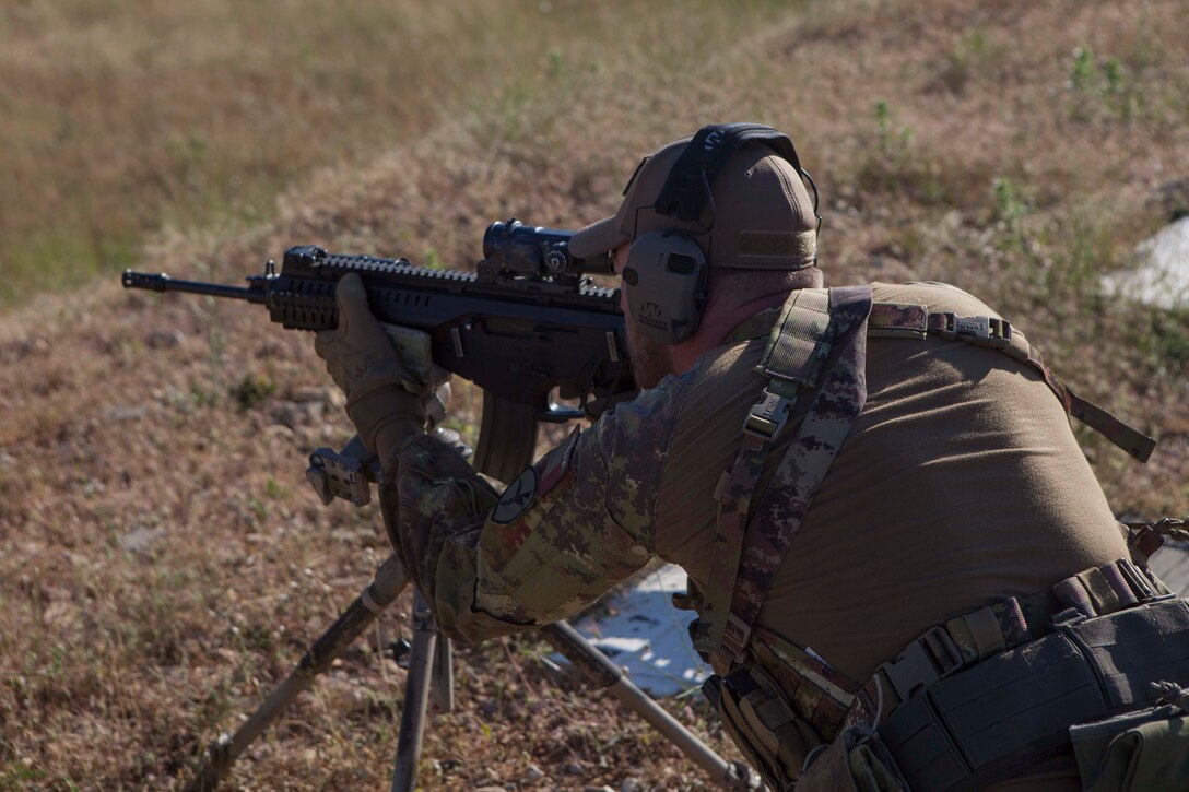 An Italian soldier executes a stress-shoot during exercise Long Precision 2019 in Uceda, Spain, June 10, 2019. U.S. Marine Corps snipers with Special Purpose Marine Air-Ground Task Force-Crisis Response-Africa 19.2, Marine Forces Europe and Africa, trained alongside snipers from Spain, Italy, France, and U.S. Army’s 173rd Airborne Brigade during Long Precision to increase their proficiency and multilateral interoperability. SPMAGTF-CR-AF is deployed to conduct crisis-response and theater-security operations in Africa and promote regional stability by conducting military-to-military training exercises throughout Europe and Africa. (U.S. Marine Corps photo by Capt. Clay Groover)