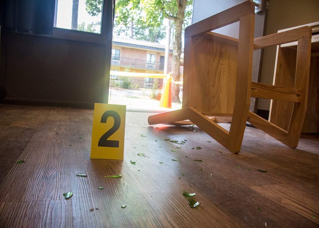 A crime scene marker rests on the floor of a simulated crime scene, June 26, 2019, at Moody Air Force Base, Ga. Investigators from the 23d Security Forces Squadron are required to respond to incidents and scenarios that require a higher level of attention and sensitivity. Investigators are responsible for the collection, preservation and transportation of evidence from a crime scene along with suspect detainment and interrogation.  (U.S. Air Force photo by Airman 1st Class Eugene Oliver)