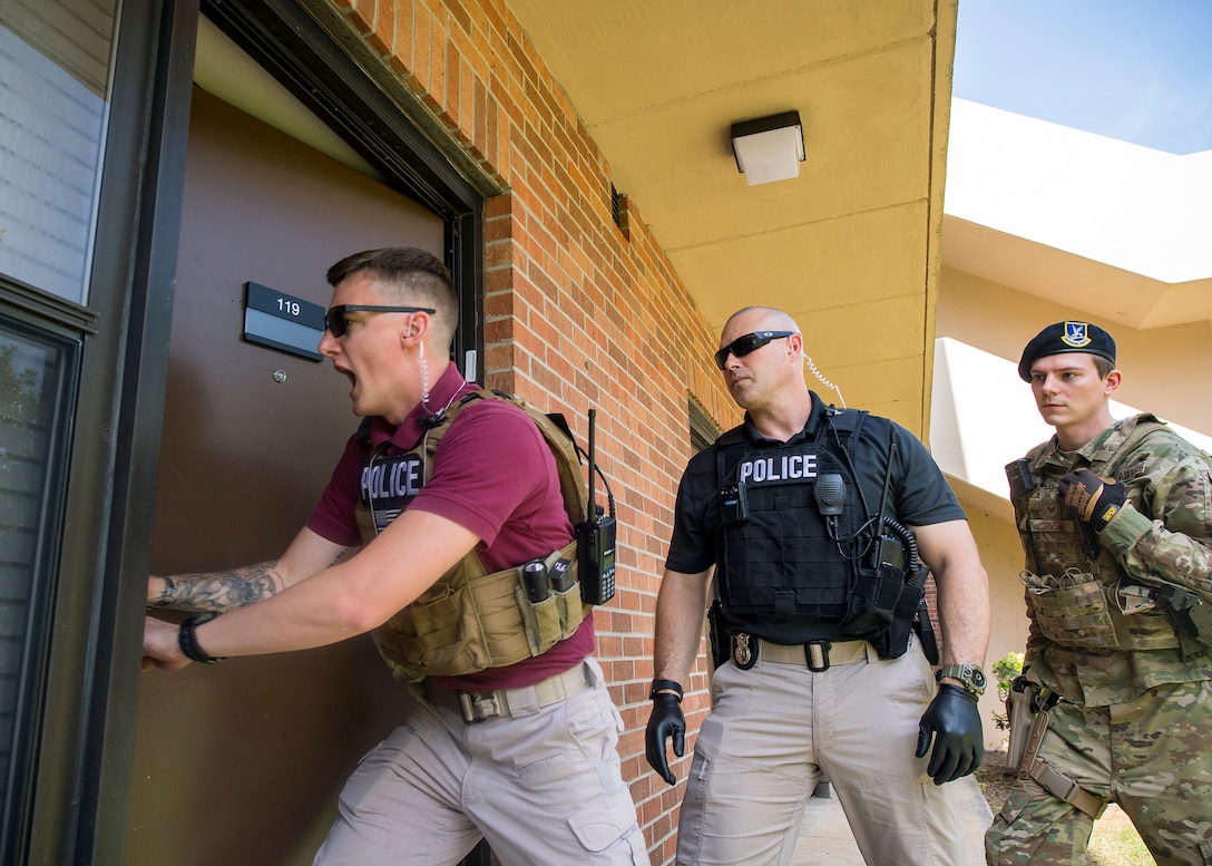 Investigators from the 23d Security Forces Squadron, enter a simulated crime scene during crime scene investigation training, June 26, 2019, at Moody Air Force Base, Ga. Security forces investigators are required to respond to incidents and scenarios that require a higher level of attention and sensitivity. After gathering the facts and evidence from a crime scene, investigators will locate, apprehend and interrogate the suspect to determine if a crime was committed. (U.S. Air Force photo by Airman 1st Class Eugene Oliver)
