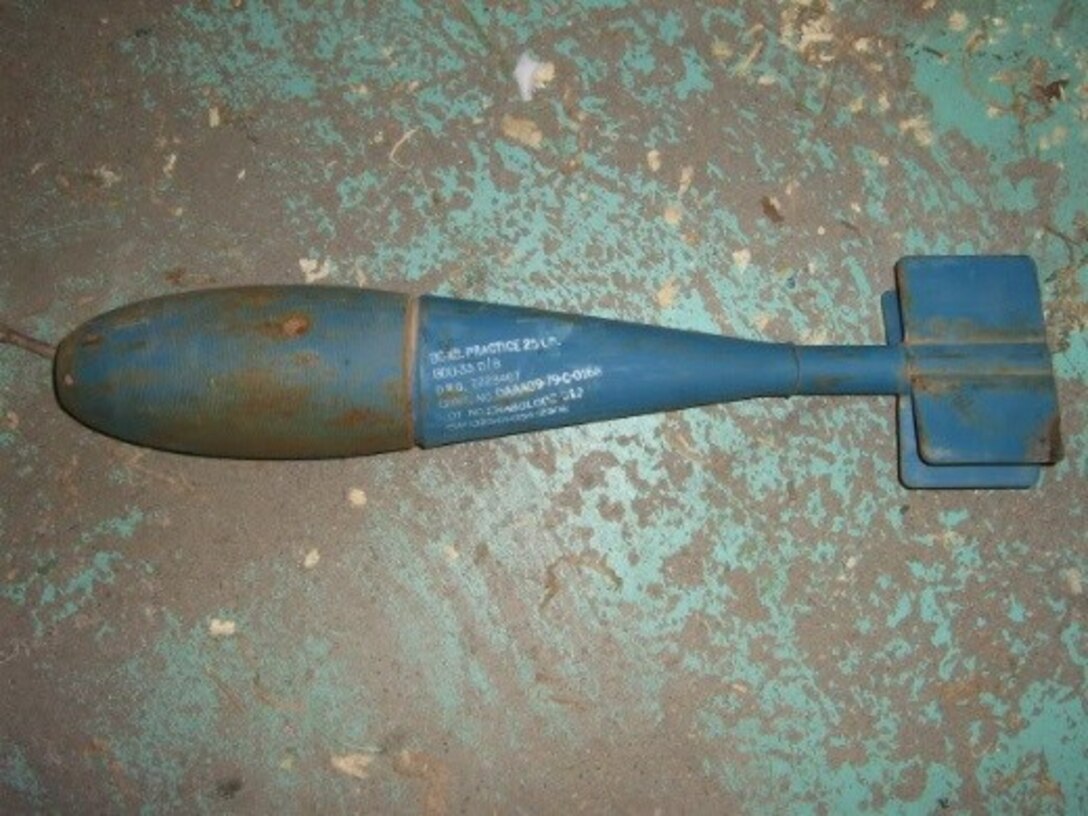 The BDU-33 is a 25-pound training munition used to simulate the M1a-82 500-pound bomb. It is approximately 22 and a half inches long and is blue in color. Although the training munition is inert, it is equipped with a small pyrotechnic charge and should not be handled.
