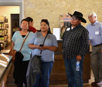 Attendees of a tribal conference hosted by Joint Base San Antonio view an exhibit at the Fort Sam Houston Museum at JBSA-Fort Sam Houston June 25. Representatives of three federally recognized Native American tribes attended the conference, whose purpose was to establish relations and to discuss issues and topics of concern between the tribes and JBSA officials.