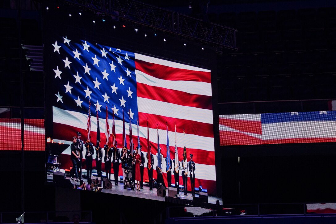 The National Anthem is played at the 2019 DoD Warrior Games closing ceremony at Amalie Arena, Tampa, Florida, June 30, 2019. The Warrior Games showcase the resilient spirit of today’s wounded, ill or injured service members from all branches of the military and provide a venue for recovering service members and veterans to demonstrate triumph over significant physical or invisible wounds and injuries.