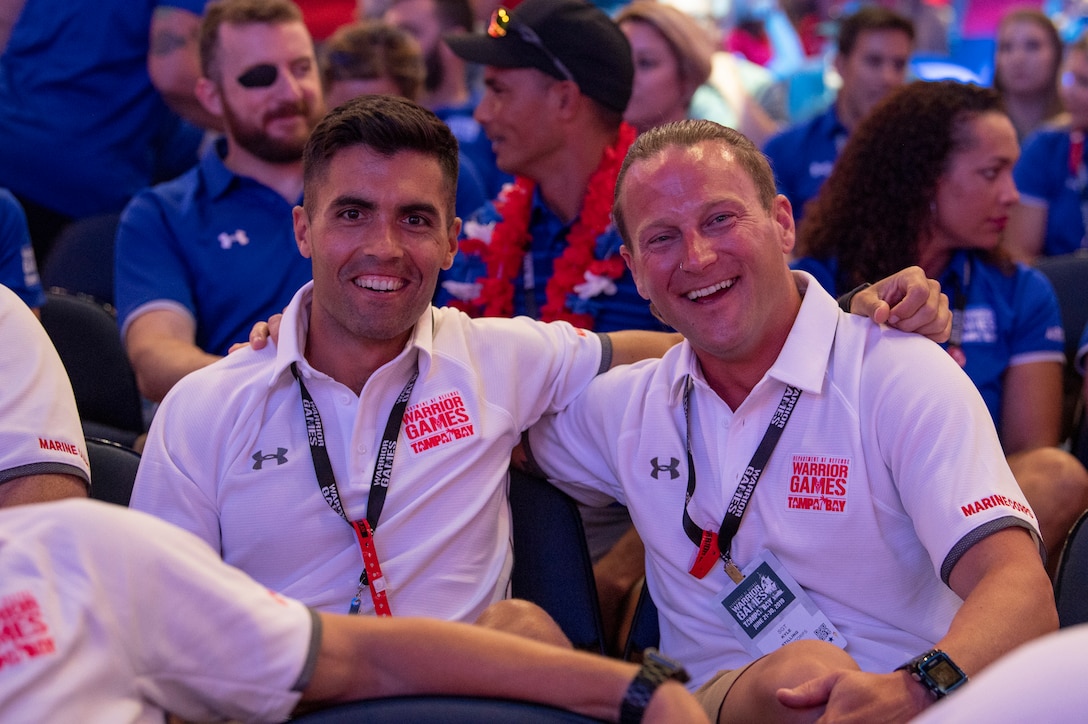 U.S. Marine Corps Capt. Patrick Nugent and veteran Kyle Stilling celebrate at the 2019 Warrior Games closing ceremony at Amalie Arena in Tampa, Florida, June 30. The Warrior Games showcase the resilient spirit of today’s wounded, ill or injured service members from all branches of the military and provide a venue for recovering service members and veterans to demonstrate triumph over significant physical or invisible wounds and injuries.