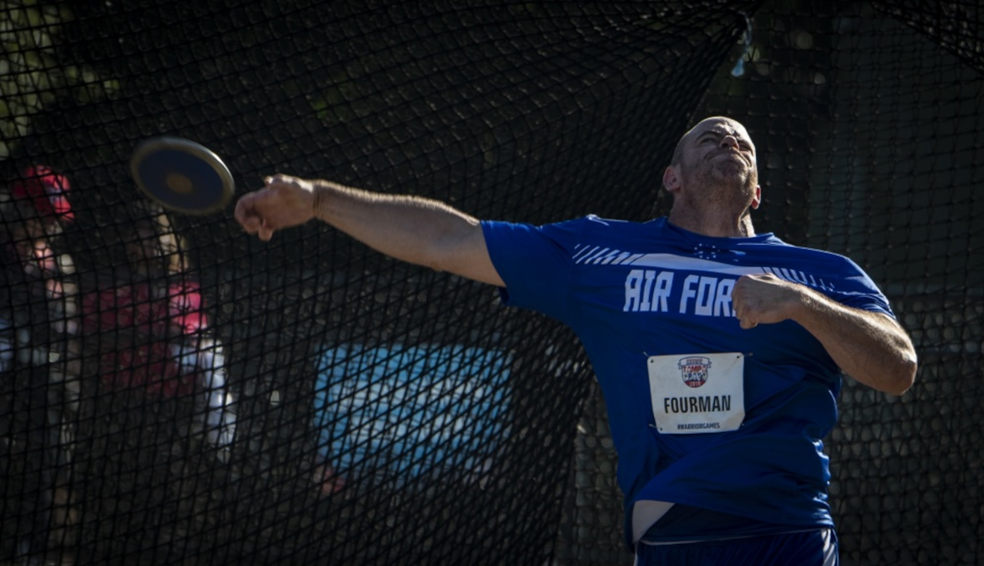 U.S. Air Force Tech. Sgt Steve Fourman, Team Air Force athlete, hurls a discus during the Department of Defense Warrior Games field competition in Tampa, Fla., June 23, 2019. Warrior Games athletes have overcome significant physical and psychological challenges, not always visible to others and have demonstrated that life continues after becoming wounded, ill or injured. (U.S. Air Force photo by Staff Sergeant James R. Crow)