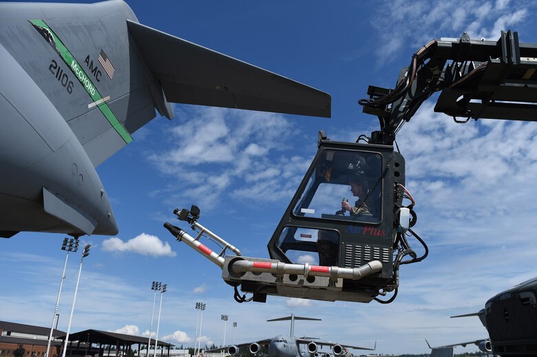 Gen. Maryanne Miller, Air Mobility Command commander, ascends in a de-icing bucket June 25, 2019, at Joint Base Lewis-McChord, Wash.