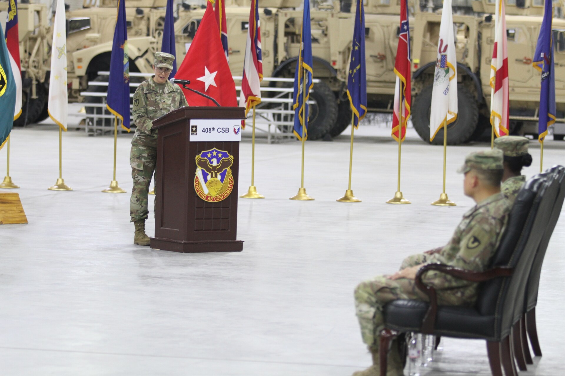 Colonel Christine A. Beeler, deputy to the commanding general for outside the continental United States for Army Contracting Command, addresses the audience during her speech at the change of command ceremony for the 408th Contracting Support Brigade June 27, 2019, at Camp Arifjan, Kuwait. During the ceremony, Col. Mary O.B. Drayton officially took command of the unit from Col. Ralph T. Borja.