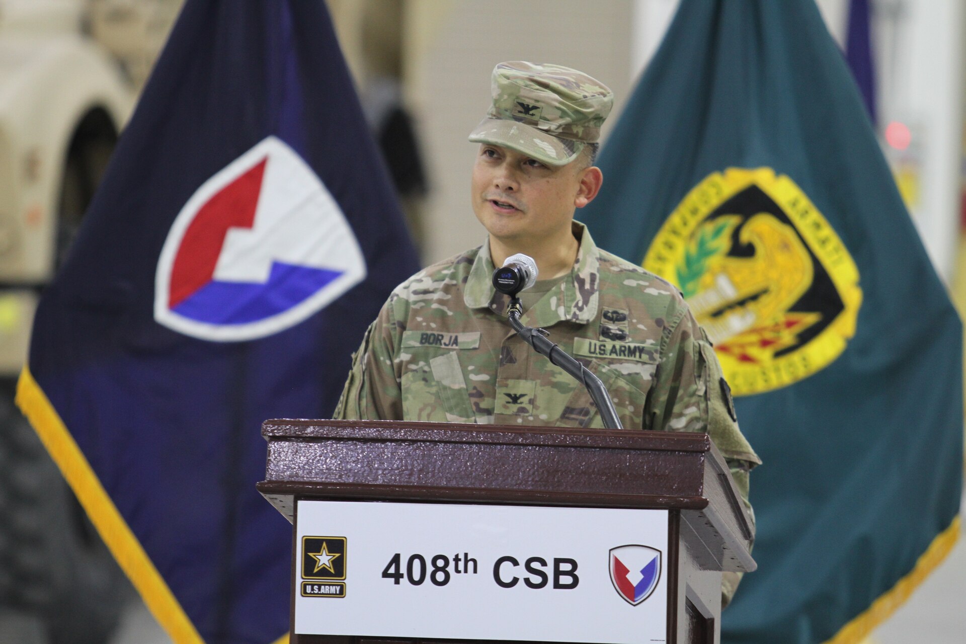 Colonel Ralph T. Borja, the outgoing commander of the 408th Contracting Support Brigade, addresses the Soldiers, civilians and contractors of the unit for the final time during the change of command ceremony June 27, 2019, at Camp Arifjan, Kuwait. Borja led the 408th CSB since June 2018 and ensured the successful awarding, managing and administration of more than $11 billion in contracts across the U.S. Army Central area of responsibility.