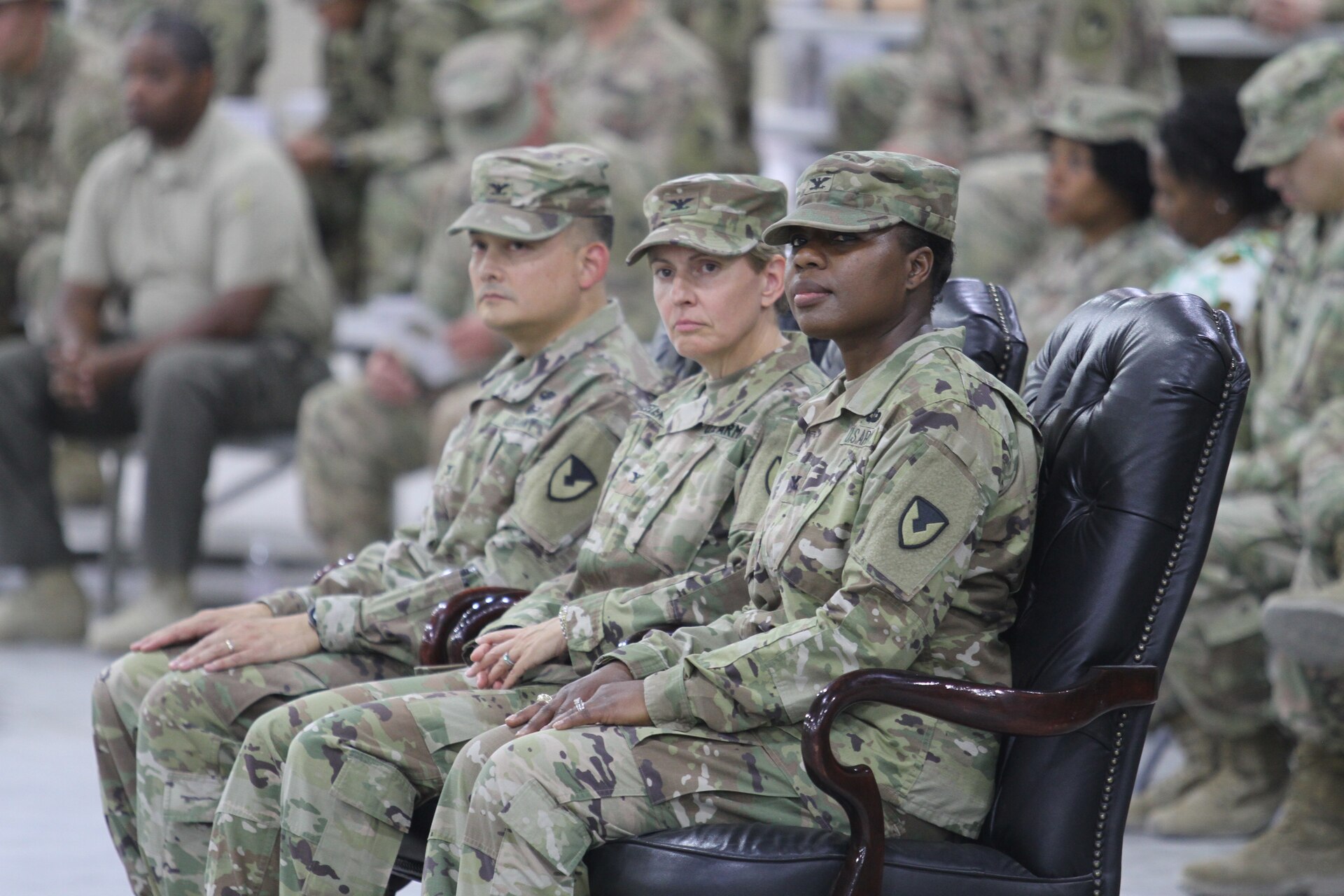 Seated from right are Col. Mary O.B. Drayton, incoming commander, 408th Contracting Support Brigade; Col. Christine A. Beeler, deputy to the commanding general for outside the continental United States Operations, U.S. Army Contracting Command; and Col. Ralph T. Borja, outgoing commander, 408th CSB; during the change of command ceremony June 27, 2019, at Camp Arifjan, Kuwait. Borja completed his one-year tour with the 408th CSB and is returning to his family in Fort Belvoir, Virginia. This is Drayton’s third assignment within the 408th CSB.