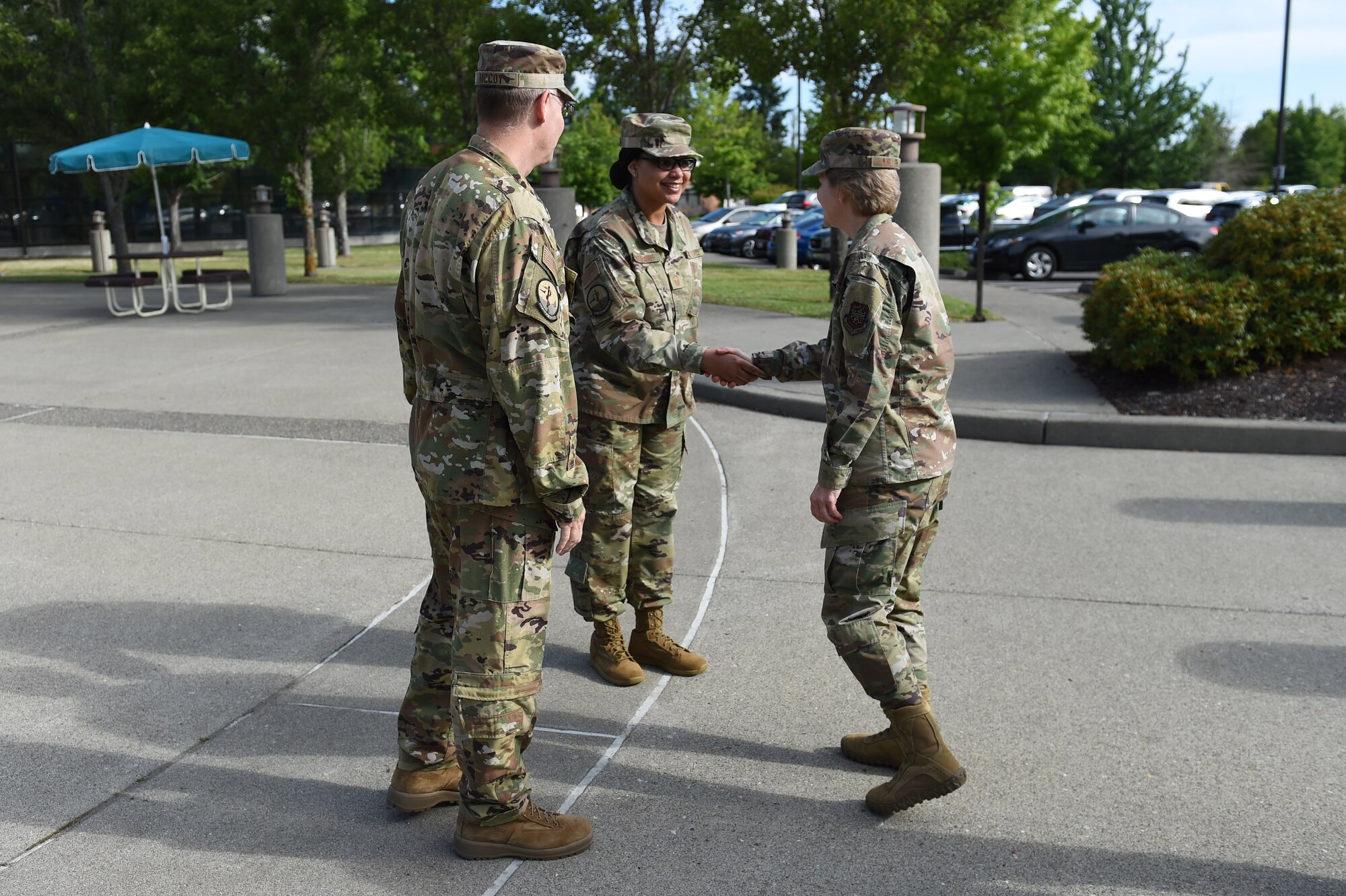 Col. Robert McCoy, 62nd Medical Squadron commander, and Senior Master Sgt. Michelle Joseph, 62nd MDS superintendent, greet Gen. Maryanne Miller, Air Mobility Command commander, June 26, 2019, in front of the 62nd MDS on Joint Base Lewis-McChord, Wash.