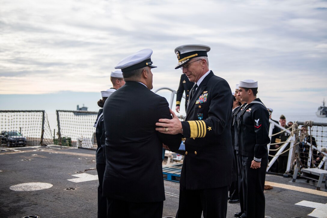 Adm. Craig S. Faller is welcomed aboard USS Michael Murphy.