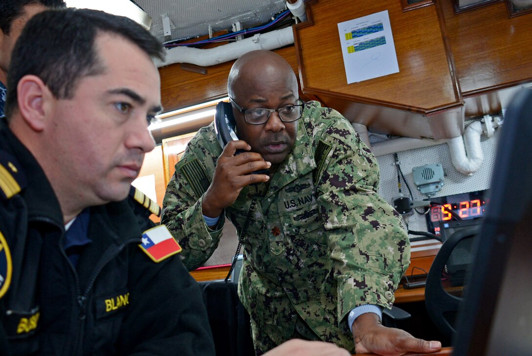 Lt. Cmdr. Tyrell Mitchell troubleshoots CENTRIX chat room during UNITAS LX sea exercises.