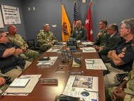 Air Force Conventional Forces Coordinator and Director of Operations, Headquarters Air Combat Command, Joint Base Langley-Eustis, Va., Air Force Maj. Gen. Kevin Huyck is briefed by the top leaders at Joint Task Force Civil Support (JTF-CS) during a visit to the command’s headquarters. JTF-CS employs conventional Air Force forces such as the Air Force Radiological Assessment Team, combat camera, the Expeditionary Medical Support (EMEDS), and the Rapid Engineer Deployable Heavy Operational Repair Squadron Engineers (REDHORSE). When directed, JTF-CS is ready to respond in 24 hours to provide command and control of 5,200 federal military forces located at more than 36 locations throughout the nation in support of civil authority response operations to save lives, prevent further injury and provide critical support to enable community recovery. (Official DoD photo by Lt. Col. Karen Roganov/released)