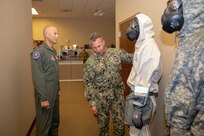 Air Force Conventional Forces Coordinator and Director of Operations, Headquarters Air Combat Command, Joint Base Langley-Eustis, Va., Air Force Maj. Gen. Kevin Huyck is briefed by Navy Chief Petty Officer Benjamin Allen on the Blauer BRN-94 ensemble, which is the main personal protective equipment (PPE) used at Joint Task Force Civil Support (JTF-CS), during a visit to the command’s headquarters. JTF-CS employs conventional Air Force forces such as the Air Force Radiological Assessment Team, combat camera, the Expeditionary Medical Support (EMEDS), and the Rapid Engineer Deployable Heavy Operational Repair Squadron Engineers (REDHORSE). When directed, JTF-CS is ready to respond in 24 hours to provide command and control of 5,200 federal military forces located at more than 36 locations throughout the nation in support of civil authority response operations to save lives, prevent further injury and provide critical support to enable community recovery. (Official DoD photo by Mass Communication Specialist 3rd Class Michael Redd/released)