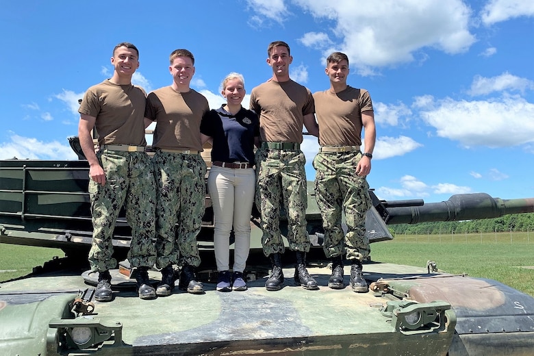 Program Executive Officer Land Systems introduced midshipmen from the U.S. Naval Academy, pictured on an M1A1 Abrams tank in June 2019, to the military acquisition process through the summer PEO LS Internship Program. The program was established in 2013 as a way to introduce cadets and midshipmen from the U.S. Military Academy and USNA to the world of Marine Corps acquisition. (Courtesy photo)
