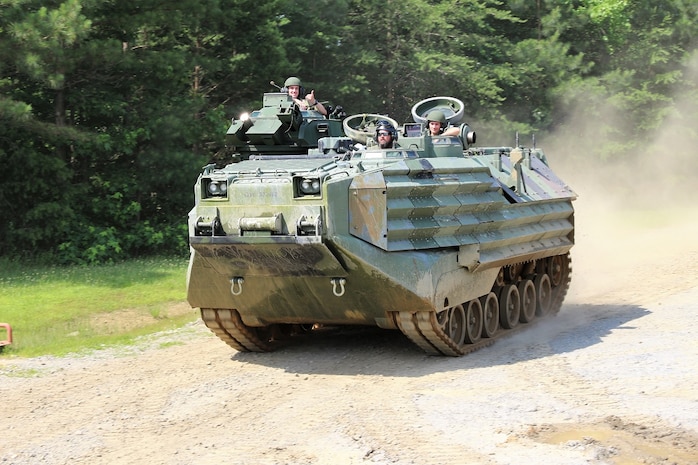 Midshipmen selected for the Program Executive Officer Land Systems 2019 Internship Program ride in an Assault Amphibious Vehicle in Ladysmith, Virginia, June 17, 2019. The program was established in 2013 as a way to introduce cadets and midshipmen from the U.S. Military Academy and USNA to the world of Marine Corps acquisition. (U.S. Marine Corps photo by Ashley Calingo)