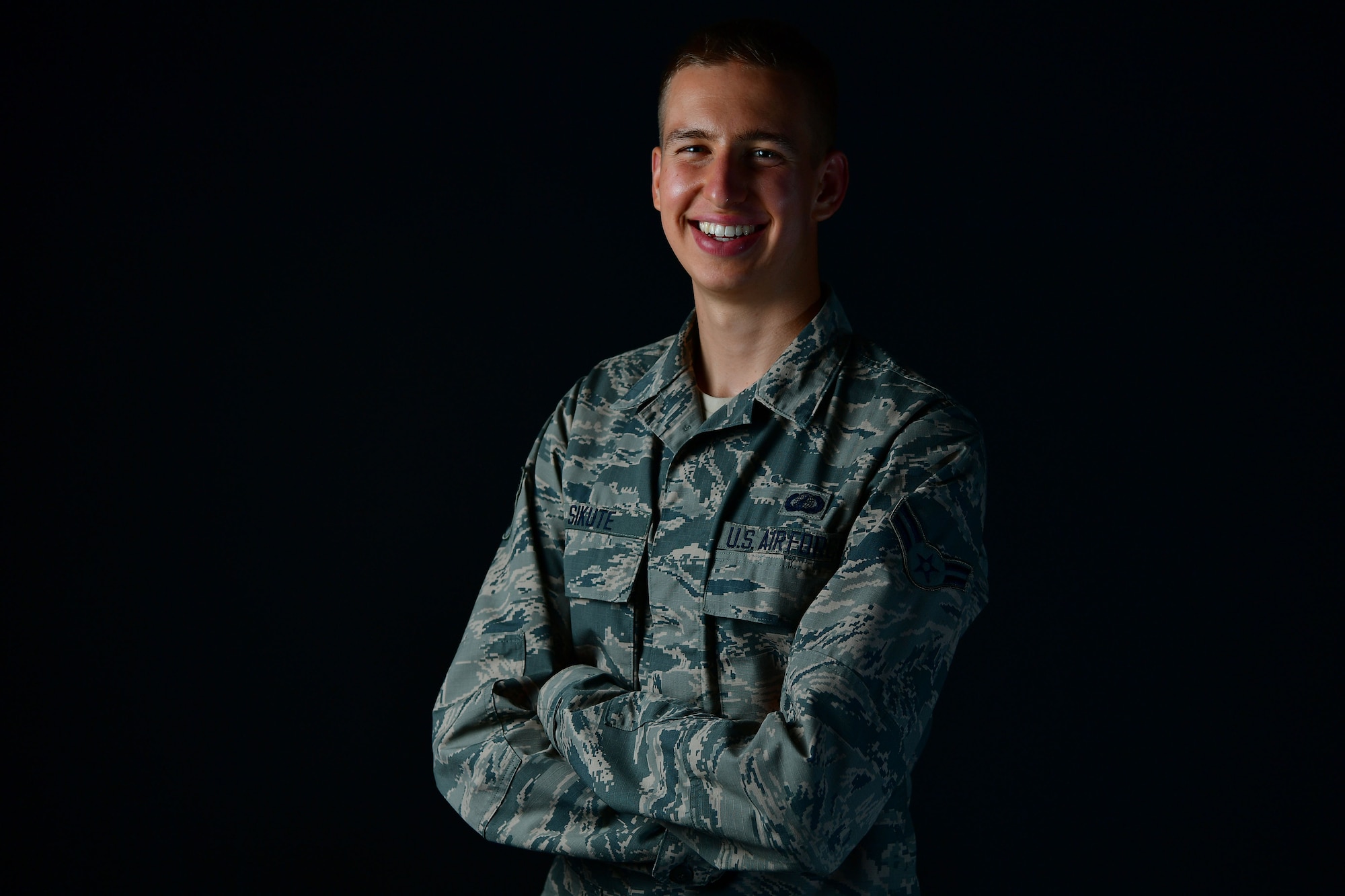 An Airman poses for a photo in the studio.