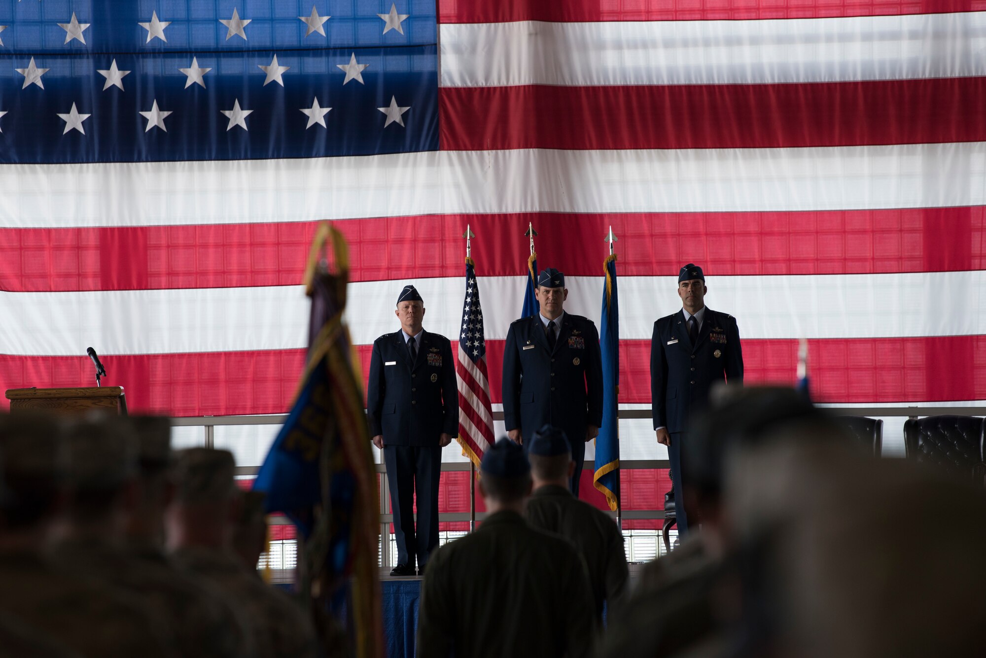 Maj. Gen. Andrew Croft, 12th Air Force (Air Forces Southern) commander, Col. Joe Kunkel, former 366th Fighter Wing commander, and Col. Richard Goodman, 366th FW commander, stand at attention during the 366th FW change of command ceremony July 2, 2019, at Mountain Home Air Base, Idaho. Croft presided over the ceremony where Goodman took command of the 366th FW from Kunkel. (U.S. Air Force photo by Airman First Class Andrew Kobialka