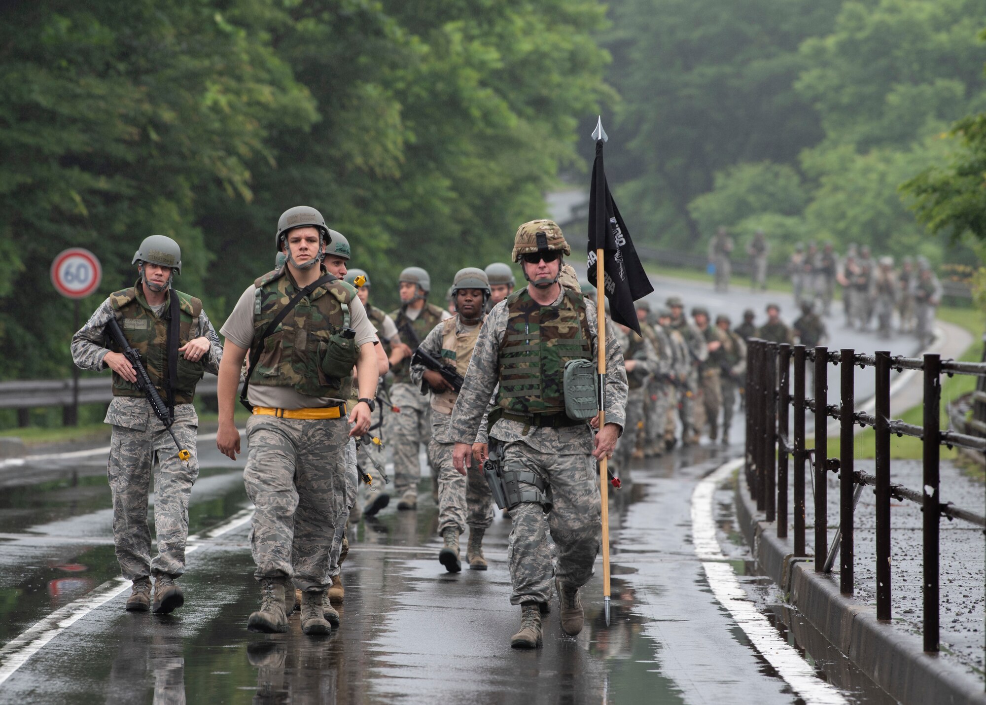 Airmen with the 35th Logistics Readiness Squadron ruck in the rain during an agile combat employment exercise at Misawa Air Base, Japan, June 28, 2019. The members performed a loose formation ruck to “Camp Defender,” where they learned how to move, shoot and communicate during realistic training scenarios. (U.S. Air Force photo by Staff Sgt. Brittany A. Chase)