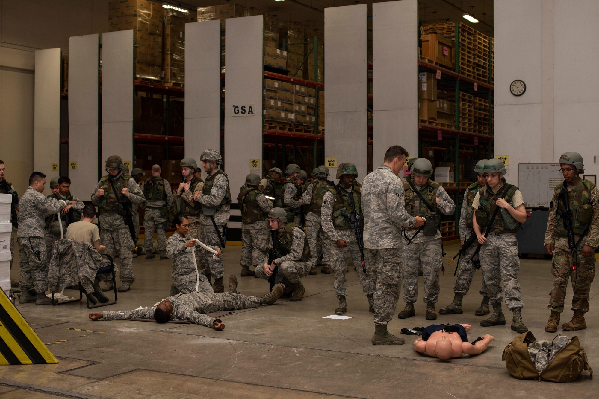 Airmen with the 35th Medical Group teach self-aid buddy care to 35th Logistics Readiness Squadron Airmen during an agile combat employment exercise at Misawa Air Base, Japan, June 28, 2019. Nearly 75 LRS Airmen learned proper tools and techniques to save lives in case of a real-real-world scenario. (U.S. Air Force photo by Staff Sgt. Brittany A. Chase)