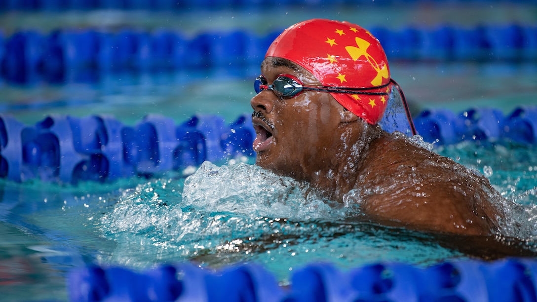 U.S. Marine Corps Lance Cpl. Carlos Jimenez takes a breath during a swimming relay at Long Aquatic Center during the 2019 DoD Warrior Games in Tampa, Florida, June 29, 2019. Jimenez would go on to earn a silver medal and two bronze medals before the swimming portion of the games came to an end. The 2019 Warrior Games consist of 13 Paralympic-style sports, and more than 300 athletes representing the U.S. Marine Corps, Army, Navy, Air Force, Special Operations Command, and five international teams.