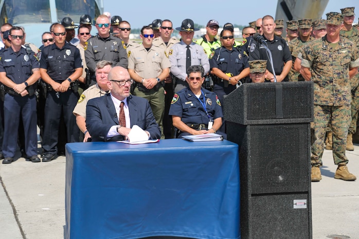 Mark Ezzell, director of the Governor’s Highway Safety Program, speaks during the 2019 Fourth of July ‘Booze it & Lose it’ event, code-named Operation Firecracker on Marine Corps Air Station New River, July 1, 2019. The event featured speakers from the air station and local law enforcement. The goal of the event was to eliminate preventable loss of life on North Carolina roadways by discouraging driving while impaired and encouraging the public to use other safe options like ride sharing and commercial transportation. This is the first time the event has been held at Marine Corps Air Station New River, which was chosen to be the backdrop due to the large concentration of young male adults who are considered to be the most at-risk age group. (U.S. Marine Corps photo by Sgt. Jonathan Sosner)