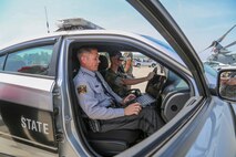 A U.S. Marine participates in a drunk driving simulator with the North Carolina State Troopers during the 2019 Fourth of July ‘Booze it & Lose it’ event, code-named Operation Firecracker on Marine Corps Air Station New River, July 1, 2019. The event featured speakers from the air station and local law enforcement. The goal of the event was to eliminate preventable loss of life on North Carolina roadways by discouraging driving while impaired and encouraging the public to use other safe options like ride sharing and commercial transportation. This is the first time the event has been held at Marine Corps Air Station New River, which was chosen to be the backdrop due to the large concentration of young male adults who are considered to be the most at-risk age group. (U.S. Marine Corps photo by Sgt. Jonathan Sosner)
