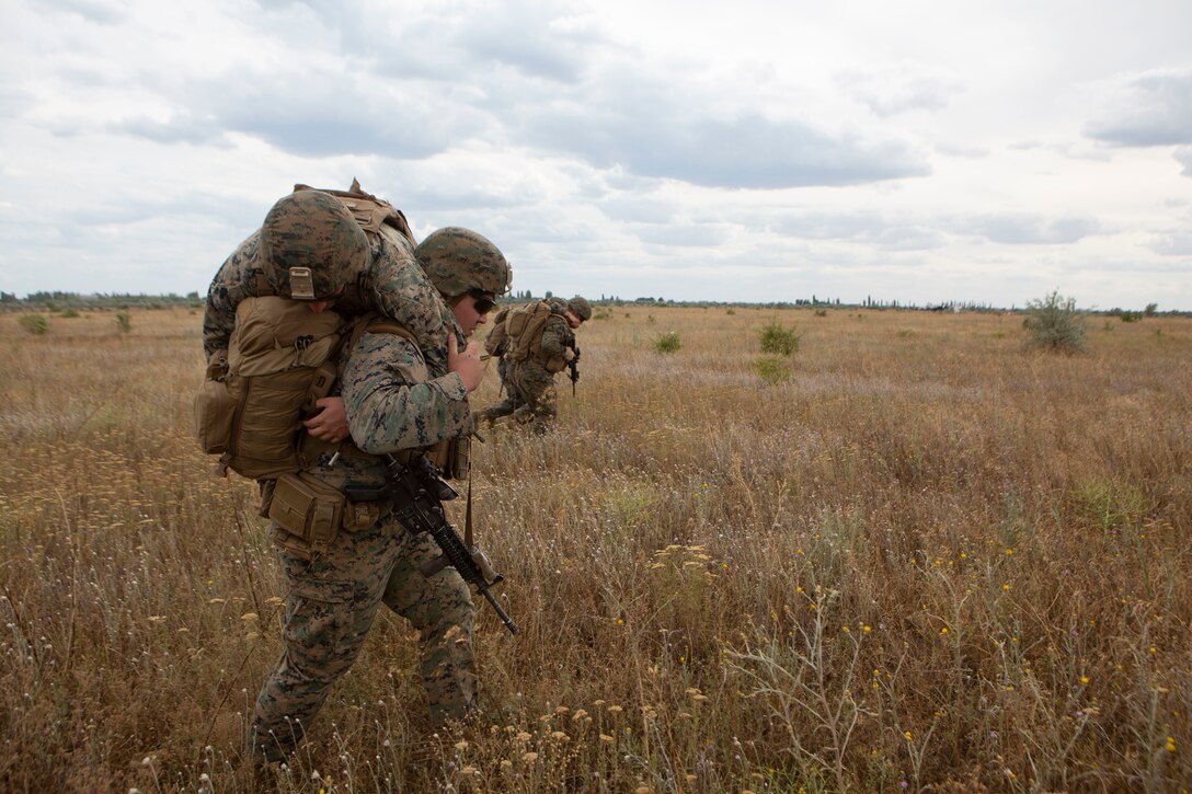 U.S. Navy Sailors with Marine Rotational Force-Europe 19.2, Marine Forces Europe and Africa, carry simulated casualties during Sea Breeze 19 in Chabanka, Ukraine, June 29, 2019. Sea Breeze is a U.S. and Ukraine co-hosted multinational maritime exercise held in the Black Sea and is designed to enhance interoperability of participating nations and strengthen maritime security and peace within our region. (U.S. Marine Corps photo by Sgt. Williams Quinteros)