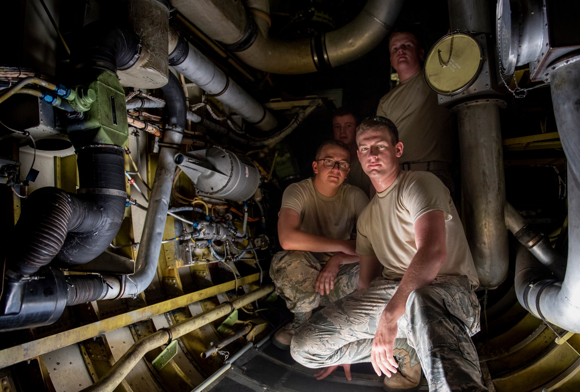 From left, Airman Greg Hogle, Airman 1st Class Daniel Miranda, Airman George Michael Singer III and Airman Brycen Brooks, 362nd Training Squadron B-52 crew chief apprentice course students, pose for a picture inside a B-52 Stratofortress at Sheppard Air Force Base, Texas, July 2, 2019. The students just started their training recently, but already love their work and are loyal to the B-52. Their love for their mission allows them to work inside the belly of the aircraft even though it traps hot air inside, making the 100 degree Texas weather outside much more desirable. (U.S. Air Force photo by Airman 1st Class Pedro Tenorio)