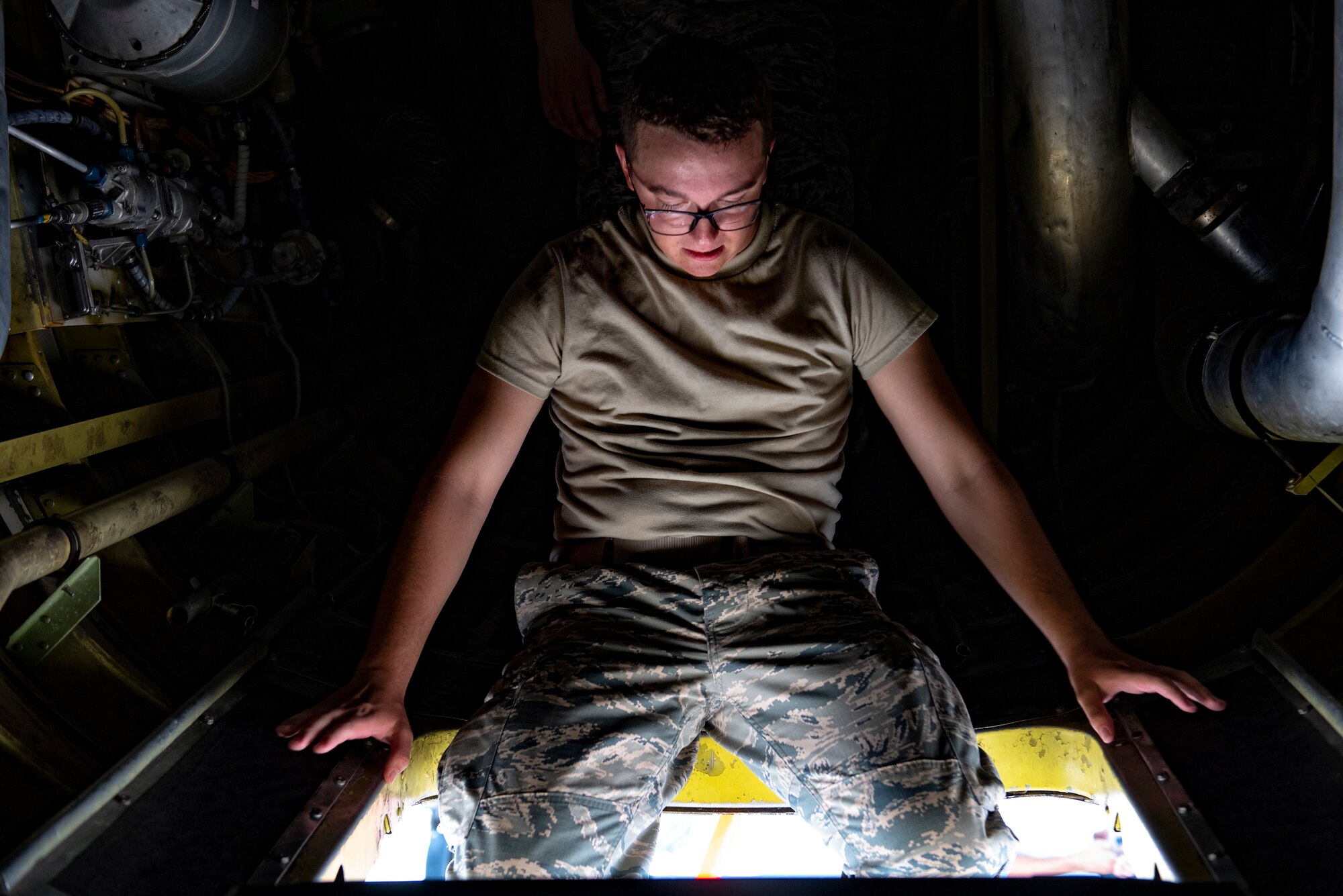 Airman Greg Hogle, 362nd Training Squadron B-52 crew chief apprentice course student, exits a B-52 Stratofortress at Sheppard Air Force Base, Texas, July 2, 2019. Hogle and his class have only recently got to work on the B-52, but are already getting a lot of experience with it, especially the experience of working inside the belly of a beast which is easily hotter than the already hot Texas weather. (U.S. Air Force photo by Airman 1st Class Pedro Tenorio)