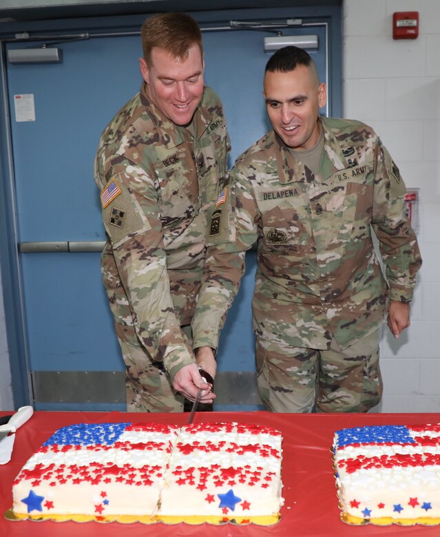 Incoming Transatlantic Division Commander Col. Christopher G. Beck and TAD Command Sergeant Major Randolph Delapena cut a cake with the TAD sword following a Change of Command ceremony held June 26, 2019, at the Winchester National Guard Armory. Beck now leads TAD's 800 employees, and construction programs exceeding $5.2 billion, directly supporting U.S. Central Command in 20 Middle Eastern countries.