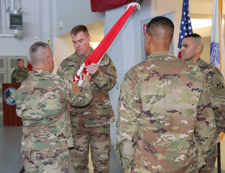 Lt. Gen. Todd T. Semonite, the 54th Chief of Engineers and U.S. Army Corps of Engineers Commanding General, passes the Transatlantic Division flag to incoming commander Col. Christopher G. Beck during a Change of Command ceremony held June 26, 2019 in Winchester, Va. The change of command is a military tradition that represents a formal transfer of authority from one commanding officer to another.