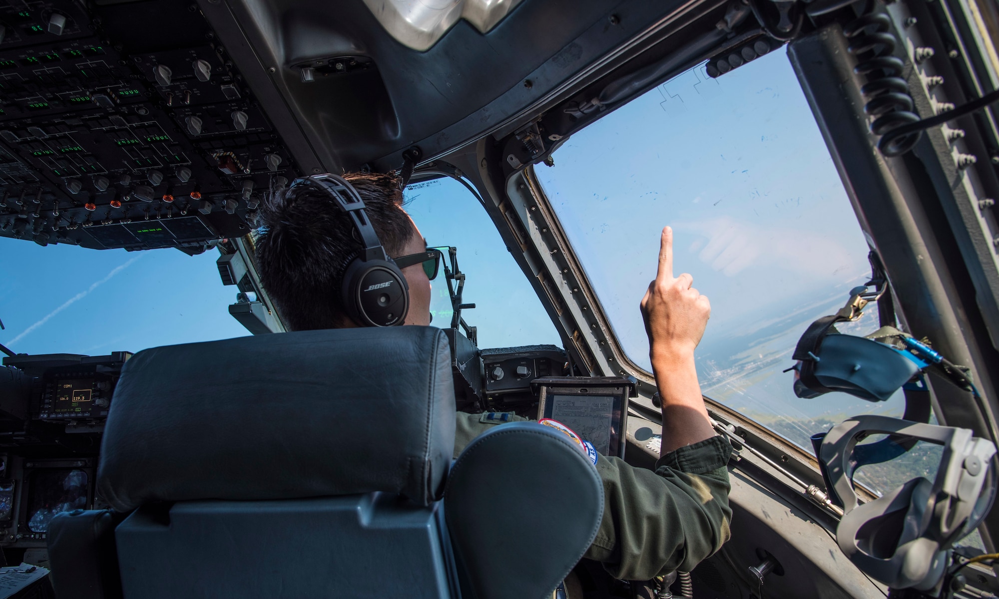 United States Air Force Captain Dennis Conner, instructor pilot with the 701st Airlift Squadron at Joint Base Charleston, South Carolina, maneuvers a C-17 Globemaster III down the coast of South Carolina July 2, 2019. A C-17 is scheduled to fly down the coast for Salute From the Shore on July 4, 2019.