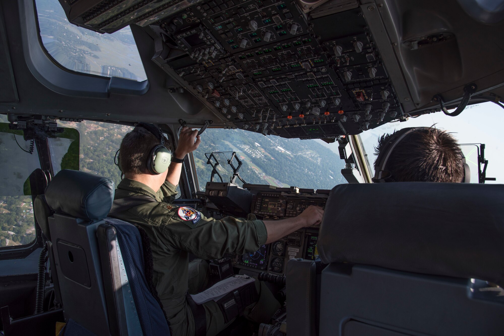 United States Air Force Major William Camp, pilot with the 701st Airlift Squadron at Joint Base Charleston, South Carolina, maneuvers a C-17 Globemaster III over Charleston, South Carolina July 2, 2019. A C-17 is scheduled to fly down the coast for Salute From the Shore on July 4, 2019.