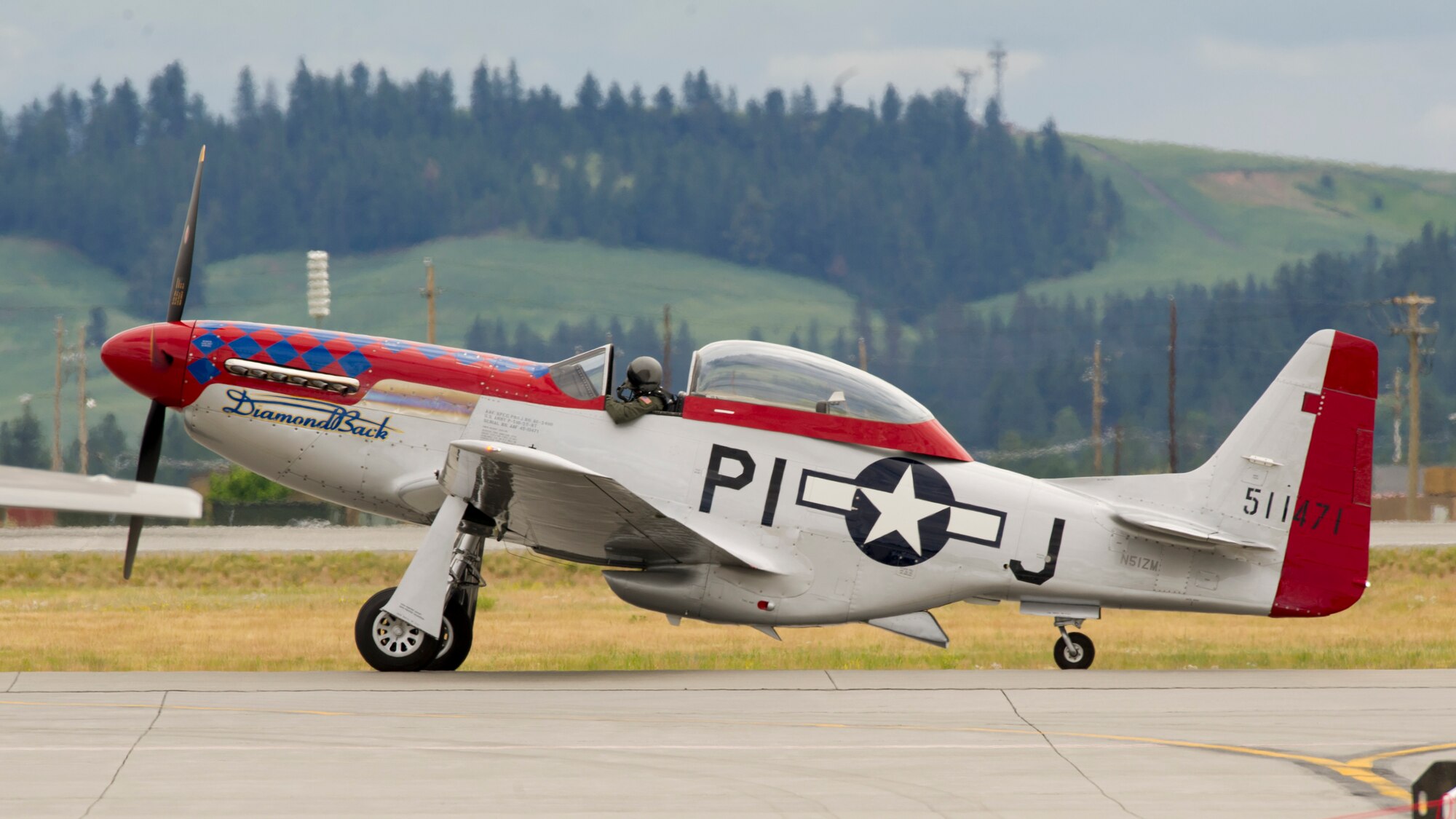 A P-51 Mustang prepares for take-off during the 2019 Skyfest Air Show and Open House opening ceremony at Fairchild Air Force Base, Washington, June 22, 2019. Fairchild opened its gates to the public for a free one-day event to showcase Pacific Northwest airpower and U.S. Air Force capabilities. The airshow included the F-22 Demonstration Team, U.S. Army Golden Knights and 11 other aerial acts. (U.S. Air Force photo by Senior Airman Ryan Lackey)