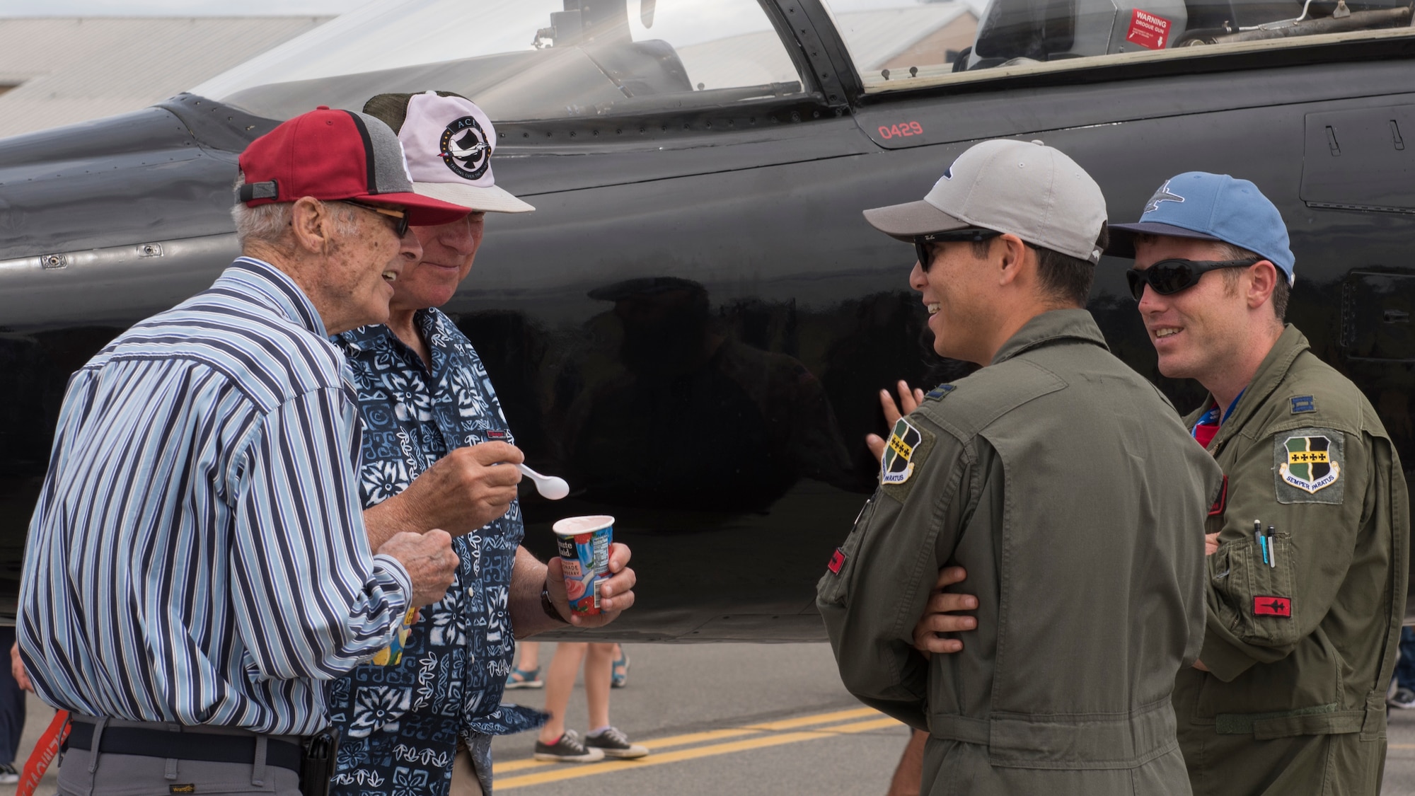 Attendees converse with pilots of a T-38 Talon static display aircraft at the 2019 Skyfest Open House and Air Show at Fairchild Air Force Base, Washington, June 22, 2019. Skyfest 2019 gave the Inland Northwest a chance to meet members of Team Fairchild and see the U.S. Air Force’s premier air refueling wing in action during a simulated KC-135 Stratotanker low-pass refuel of a C-17 Globemaster III.(U.S. Air Force photo by Senior Airman Ryan Lackey)