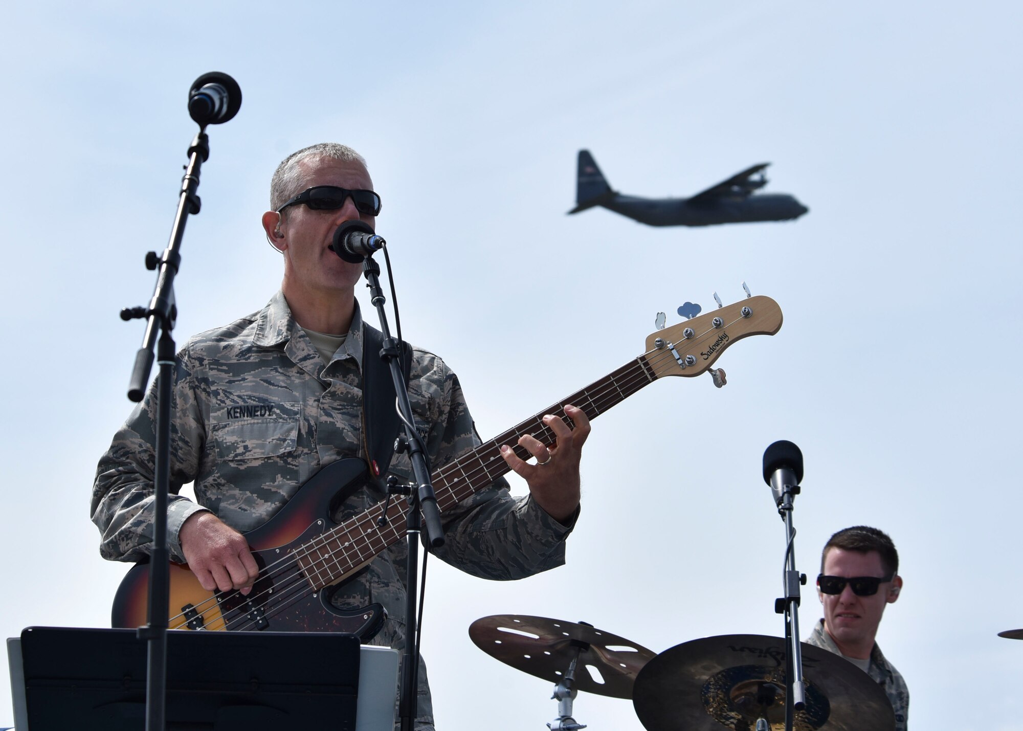 U.S. Air Force Master Sgt. Sammuel Kennedy, singer and guitarist for the U.S. Air Force Band of the Golden West, sings and plays guitar at the 2019 Skyfest Open House and Airshow on Fairchild Air Force Base, Washington, June 22, 2019. Skyfest 2019 offered a unique view of Team Fairchild’s role in enabling Rapid Global Mobility for the U.S. Air Force. The show featured more than 13 aerial acts and 16 static display aircraft, as well as other attractions and displays. (U.S. Air Force photo by Airman Kiaundra Miller)