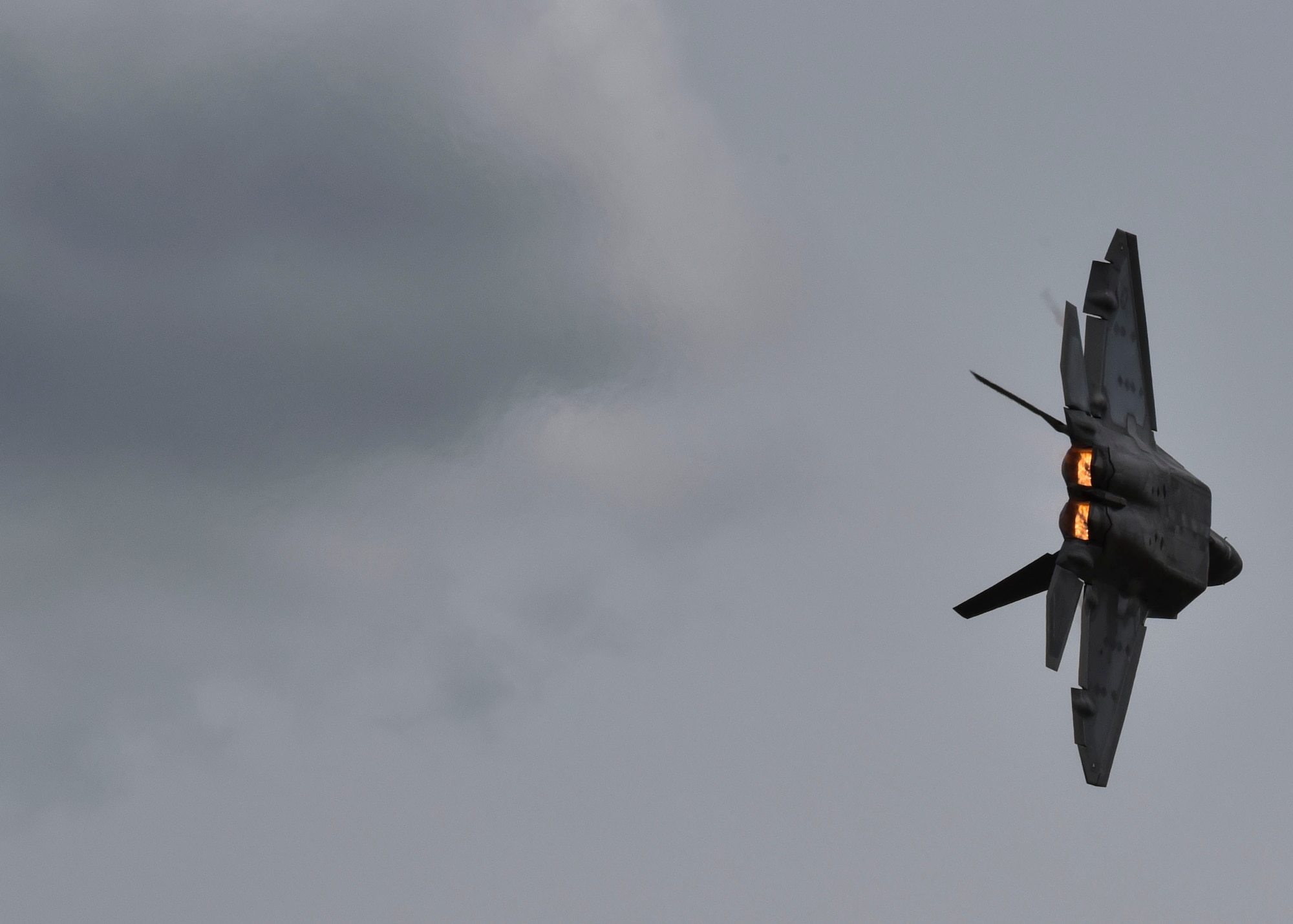 A U.S. Air Force F-22 Raptor flies during 2019 Skyfest Open House and Airshow  on Fairchild Air Force Base, Washington, June 22, 2019. Skyfest 2019 gave the Inland Northwest a chance to meet members of Team Fairchild and see the U.S. Air Force’s premier air refueling wing in action during a simulated KC-135 Stratotanker low-pass refuel of a C-17 Globemaster III. (U.S. Air Force photo by Airman Kiaundra Miller)