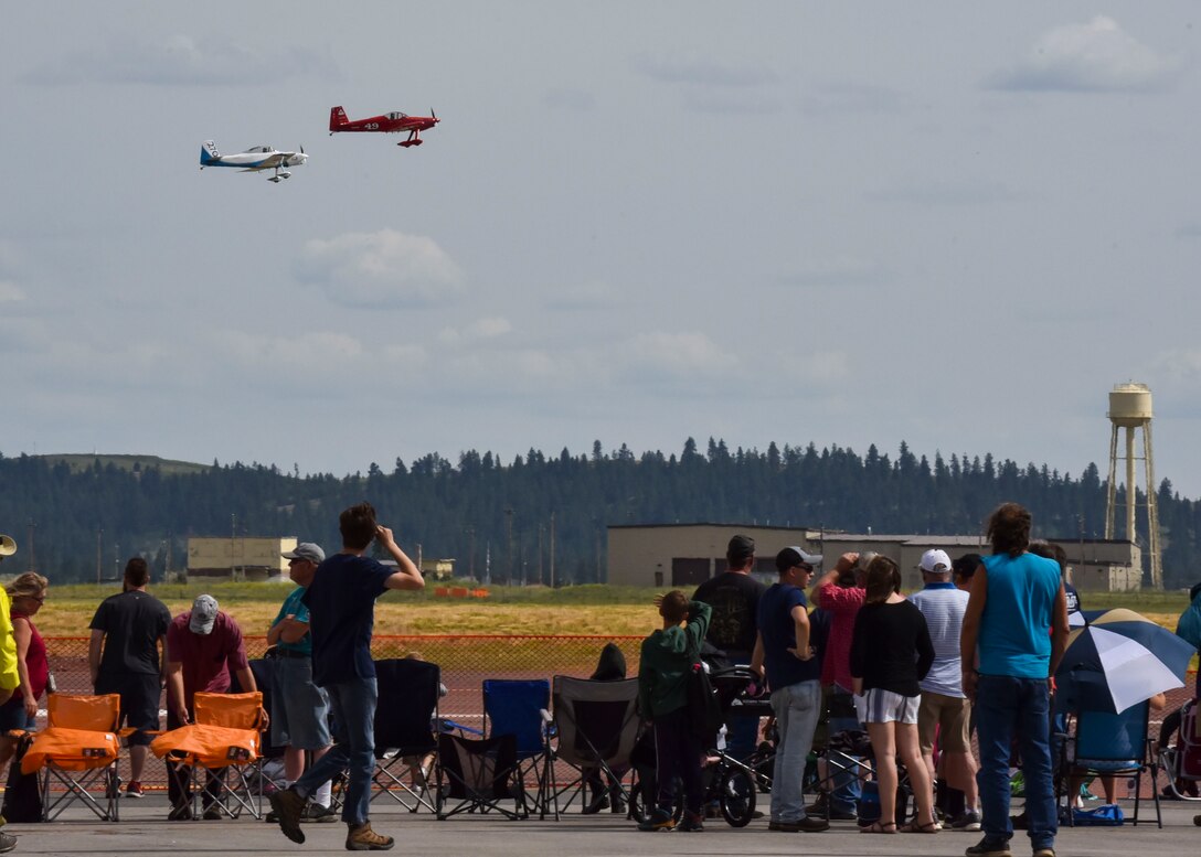 Spectators observe the Lightning Formation Airshows demonstration team at the end of their performance and the 2019 SkyFest open house and airshow on Fairchild Air Force Base, Washington, June 22, 2019. Fairchild opened its gates to the public for a free one-day event to showcase Pacific Northwest airpower and U.S. Air Force capabilities. The airshow included the F-22 Demonstration Team, U.S. Army Golden Knights and 11 other aerial acts. (U.S. Air Force photo by Airman Kiaundra  Miller)