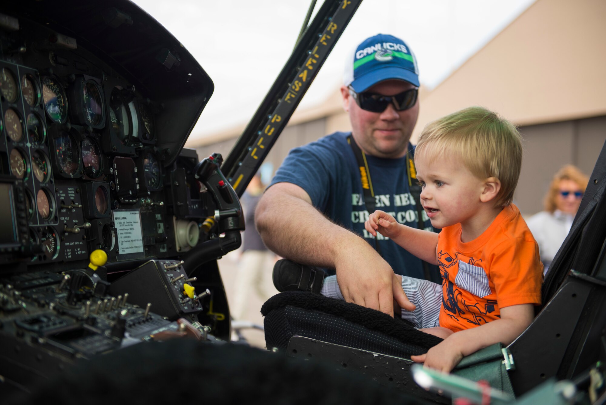 Porter, a Skyfest 2019 visitor,  sits inside the flightdeck of a UH-1N Huey during the Skyfest 2019 Open House and Airshow at Fairchild Air Force Base, Washington, June 22, 2019. Skyfest 2019 Open House and Airshow offered a unique view of Team Fairchild’s role in enabling Rapid Global Mobility for the U.S. Air Force. The show featured more than 13 aerial acts and 16 static display aircraft, as well as other attractions and displays. (U.S. Air Force photo by Airman 1st Class Lawrence Sena)